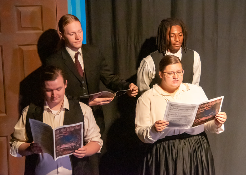 Django Burgess, junior; Michael Tate-Banks, first-year; Gage Shelton, '25; and Kaylee Brooks, senior; perform a number during the play.