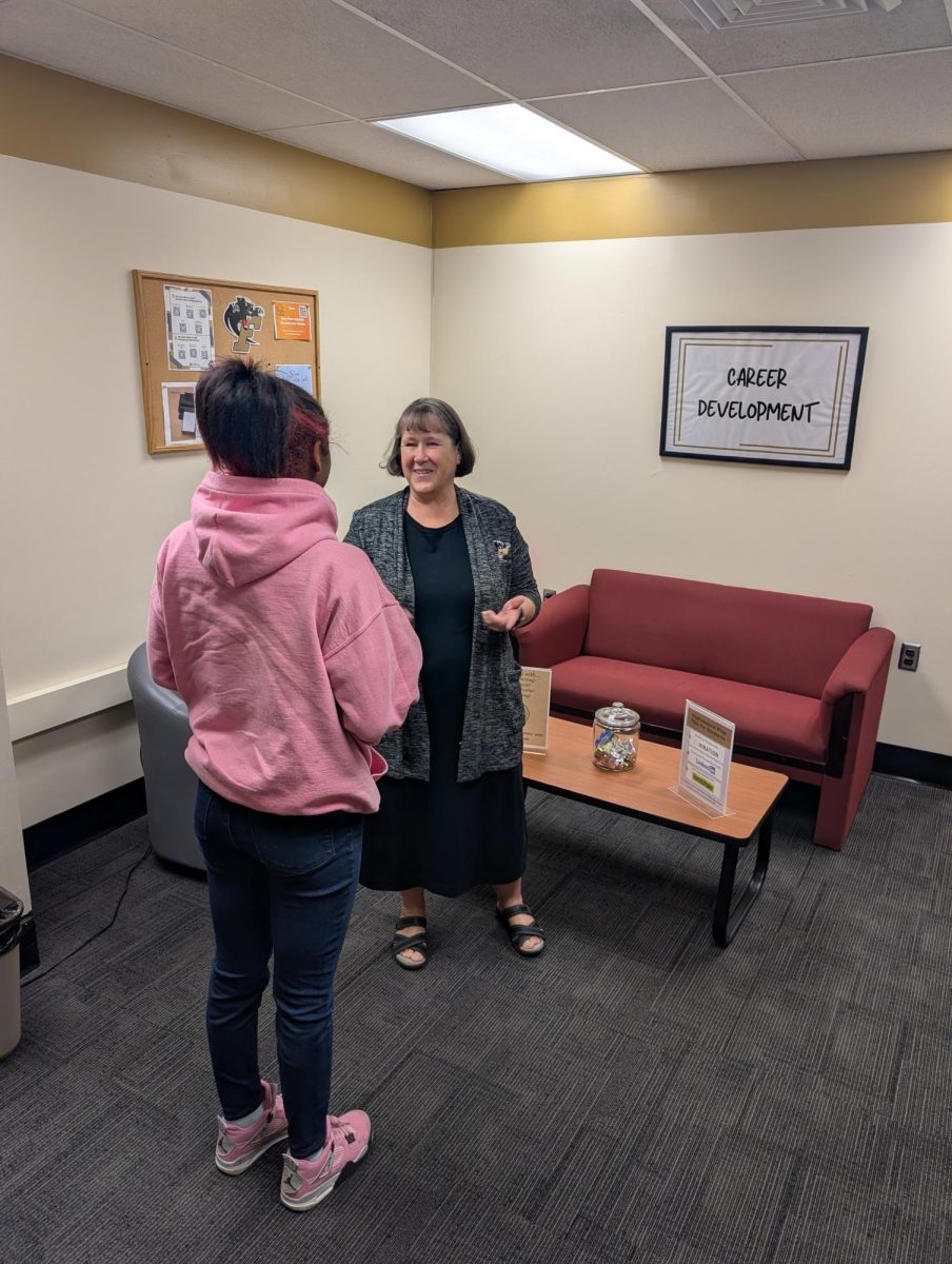 Leslie Holden, Director of Career Development; advising a student
