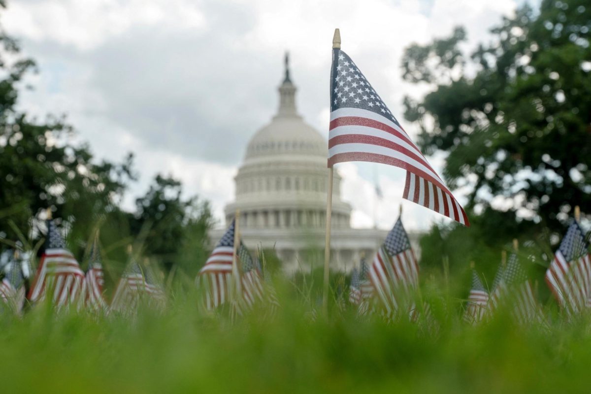 A single flag is planted in memory of Charlie Kirk alongside a field of flags marking the anniversary of the 9/11 terrorist attacks outside of US Capitol after Charlie Kirk was shot dead in Utah, in Washington, D.C., Sept. 11. REUTERS/Nathan Howard