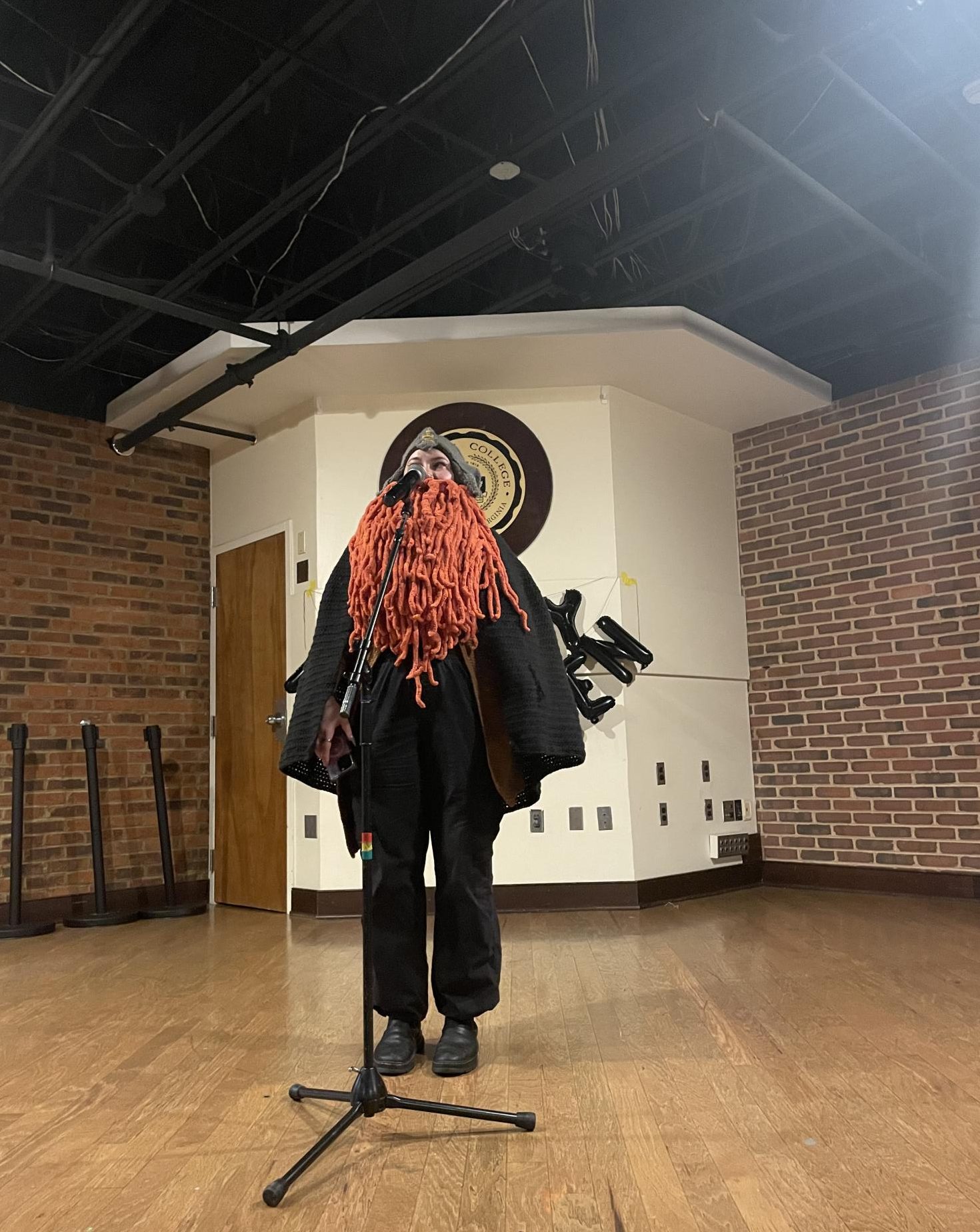 Senior Scout Lynch emcees the Halloween Open Mic Night dressed in a costume from the "Lord of the Strings".