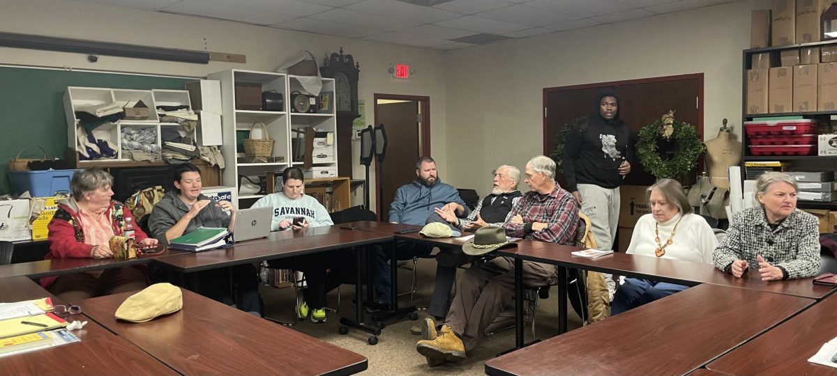 Attendees of the Ferrum Forward Committee gather around a set of tables in the Blue Ridge Institute and Farm Museum as they chatter amongst themselves before the November meeting begins. 