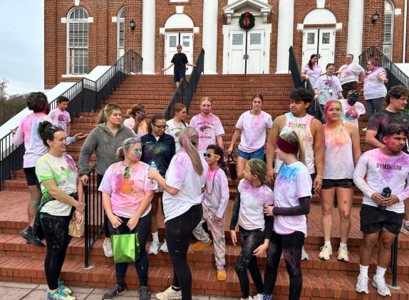 Racers gather on the Schoolfield Hall steps to show off their new colors.