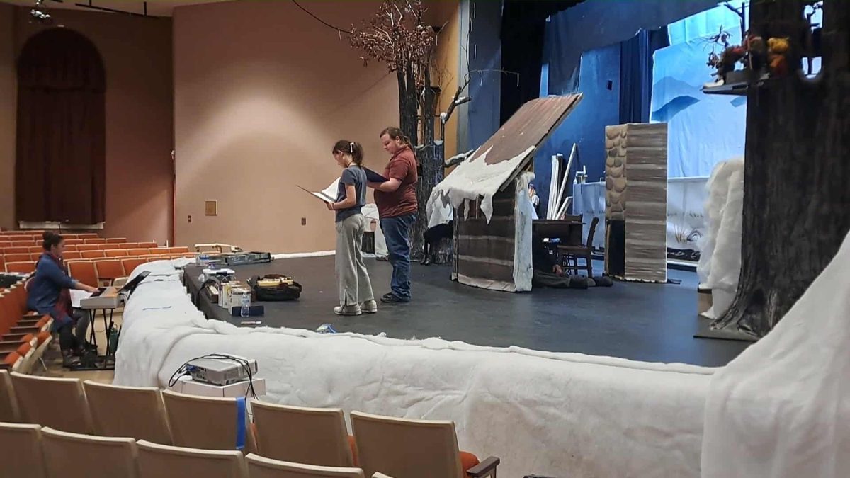 Alumnus Gage Shelton, right, and local actress Brystal Sigmon work through a scene together on stage.