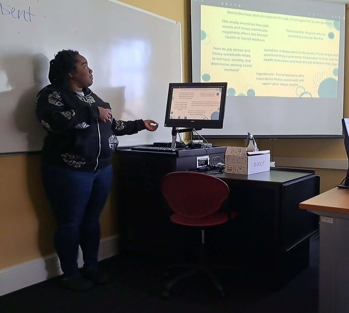 Jasmyn Layton, junior, presents her research presentation on stress, burnout, and anxiety to the class. 