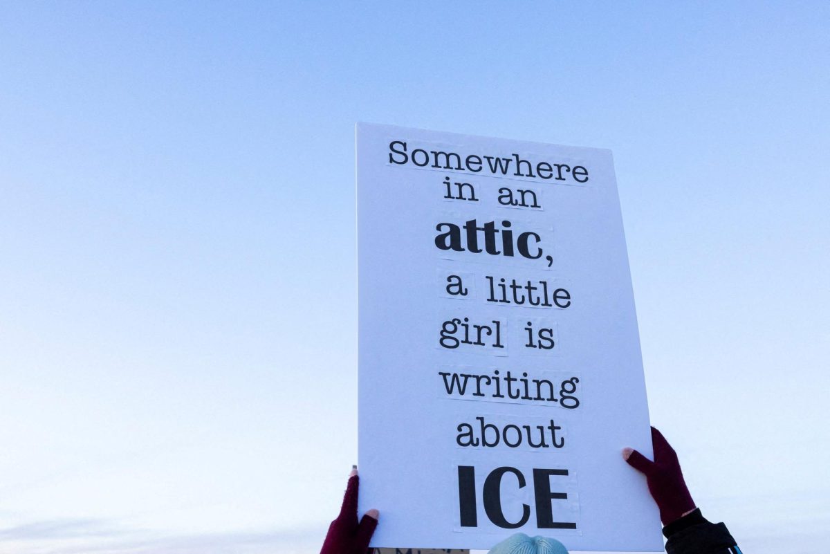 A person raises a sign in protest agains U.S. Customs Enforcement and Immigration (ICE) during a demonstration outside a dormant prison that is under contract to become an ICE detention center in Hudson, Colorado, U.S., January 21, 2026. REUTERS/Kevin Mohatt