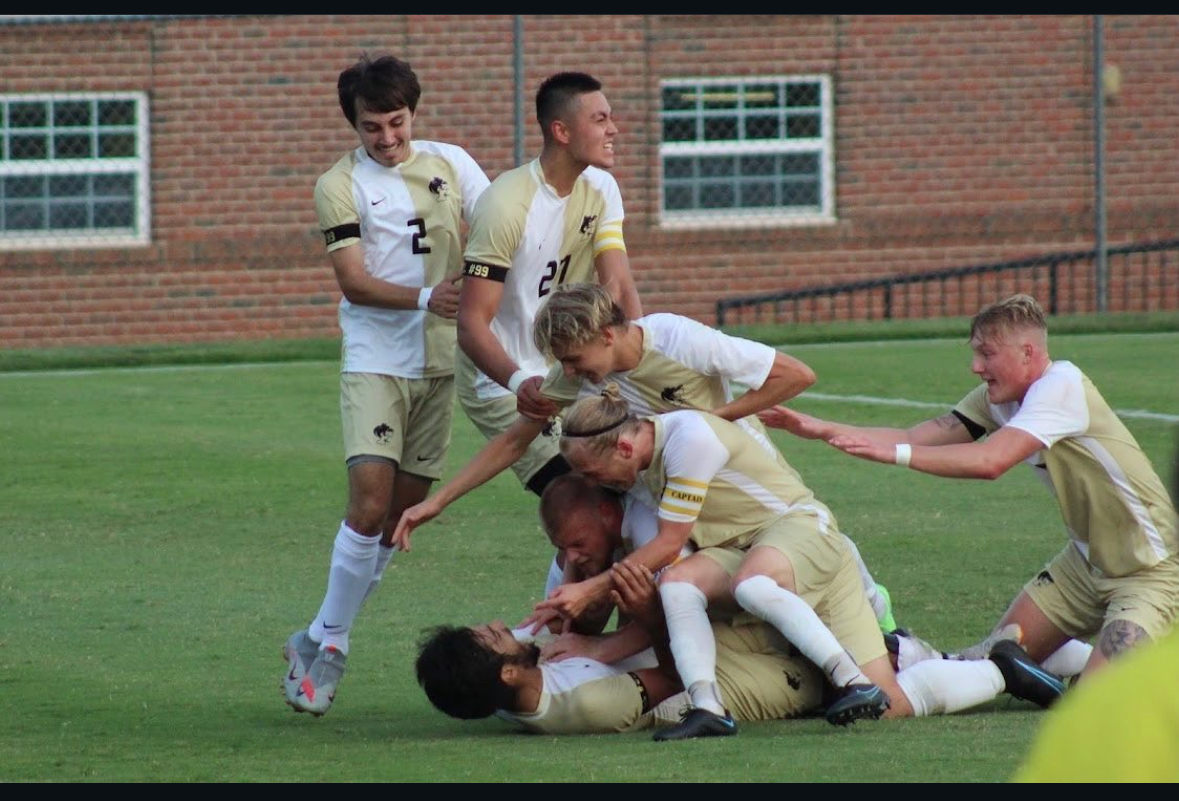 Erick Nolasco and his Ferrum teammates celebrate a home goal. 