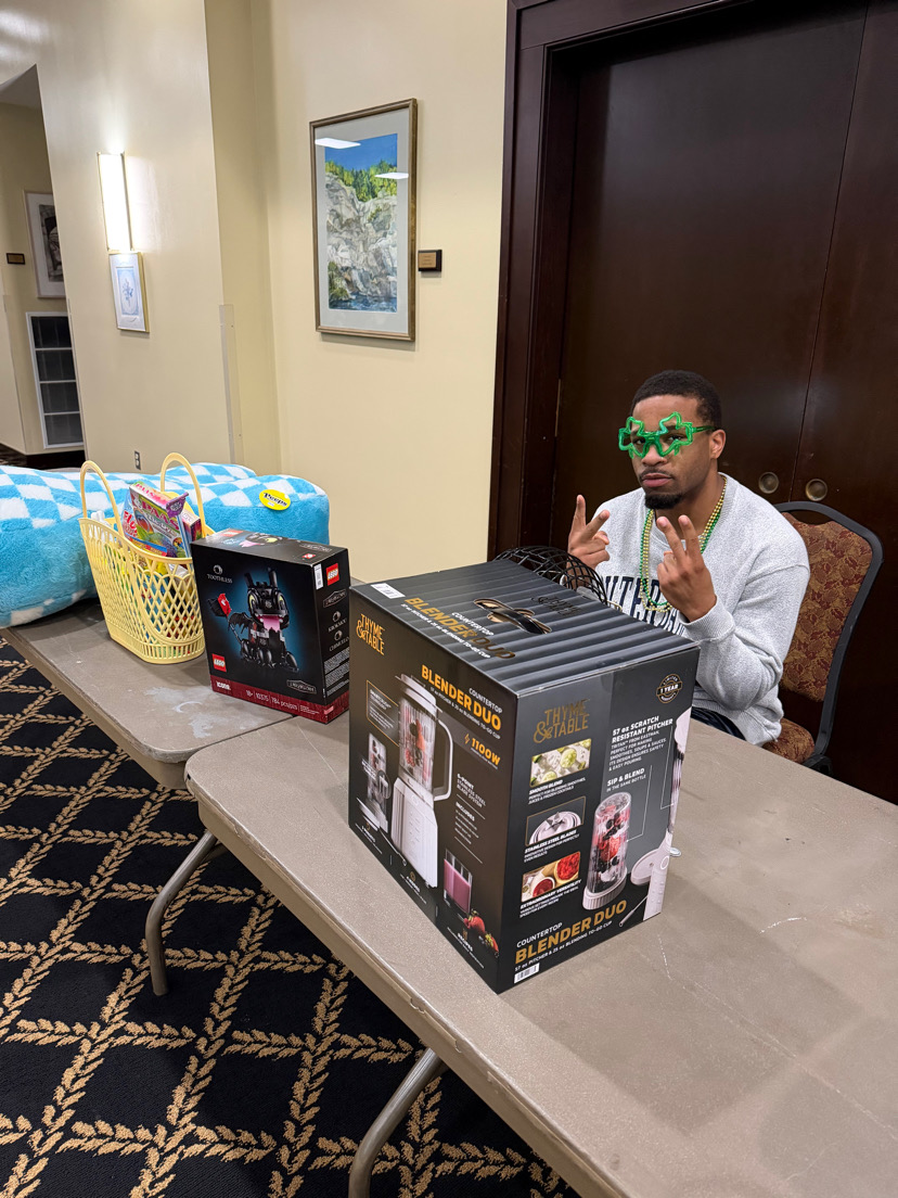 Jeremiah Walker, senior, staffs the prize table at Bingo on March 12 in the Blue Ridge Mountain Room. 