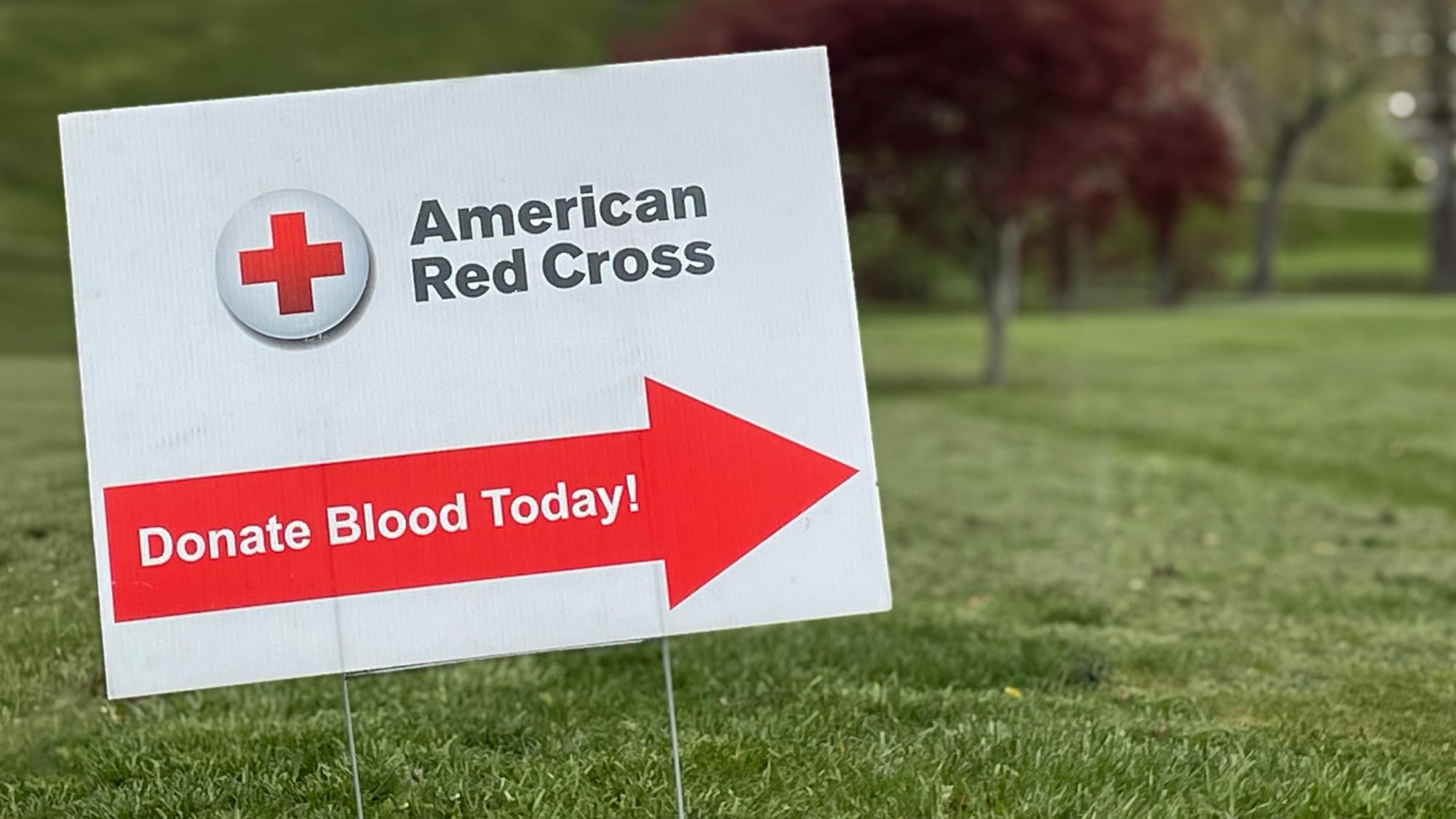 A blood drive sign sitting in front of the fitness center.