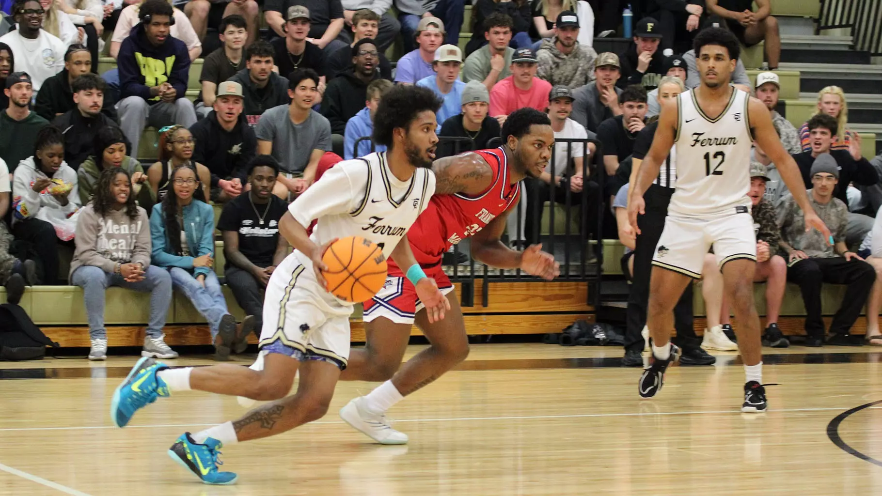 Ferrum guard Rodrigo Farias, left, drives past a defender during a Conference Carolinas tournament quarterfinal game against Emmanuel on March 6. Farias led the Panthers with 23 points.