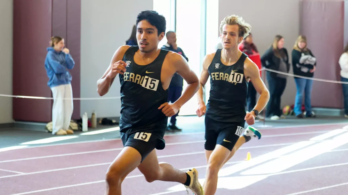 First-year Carlos Menendez (left) races alongside senior Josh Mills.