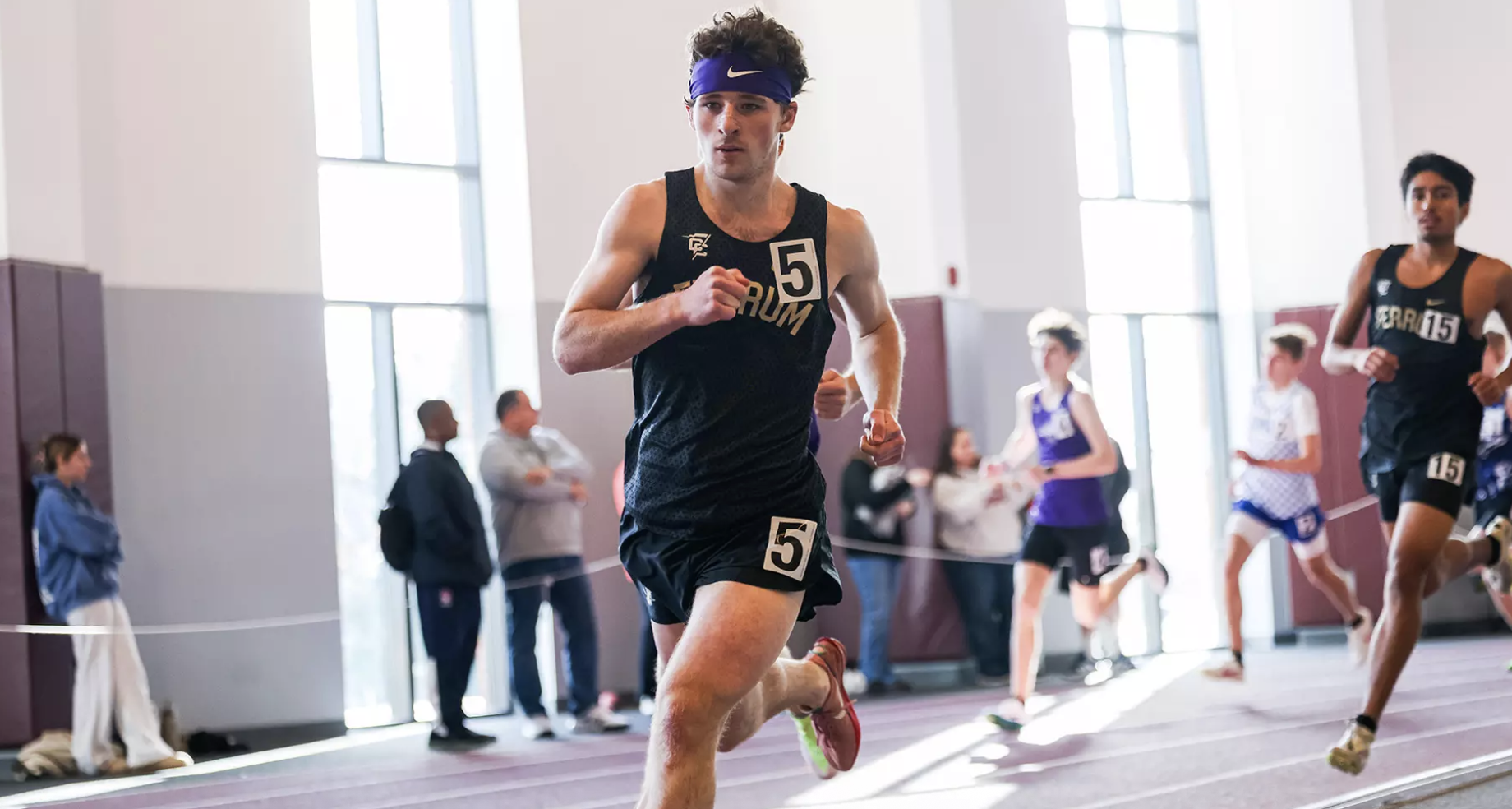 First-years Seth Truett (left) and Carlos Menendez run in the men's 800-meter race.