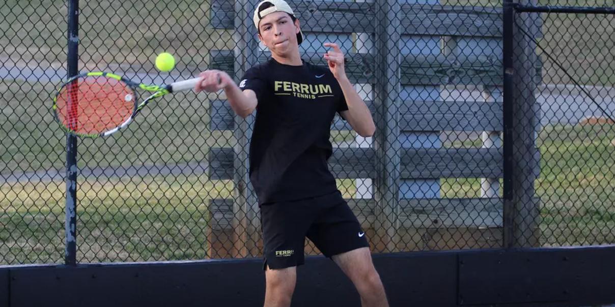 First-year Omar Martinez swings the ball back to his opponent.